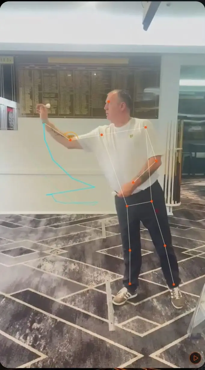 Dart Motion tracking a real throw: the pose skeleton on the player and the arm path traced through the motion